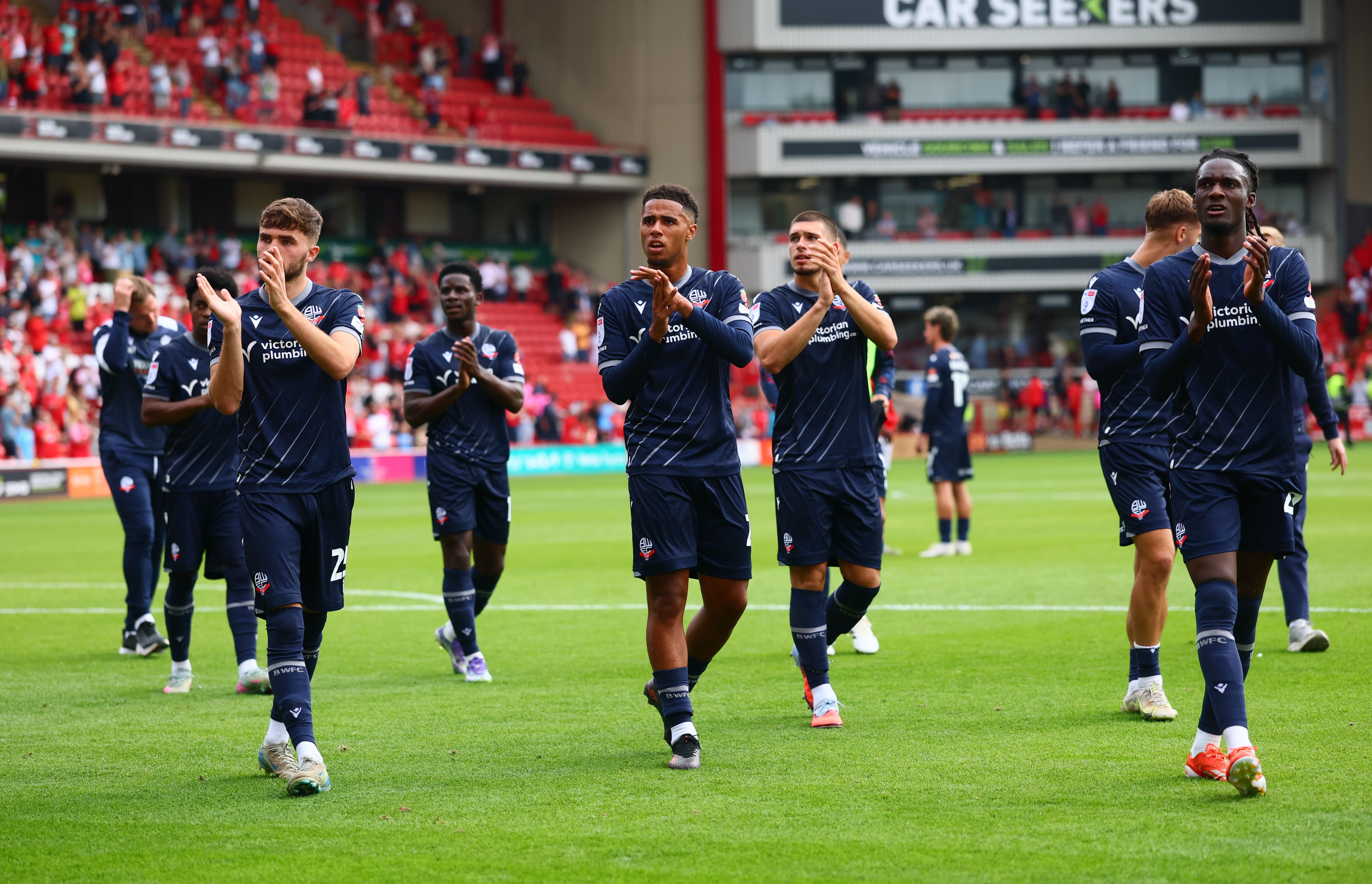 Players applauding fans after Barnsley