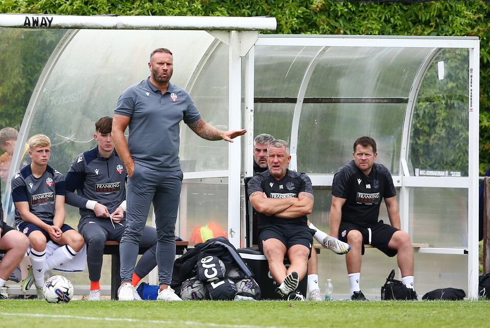 Ian Evatt and his coaching staff on the bench at Bamber Bridge
