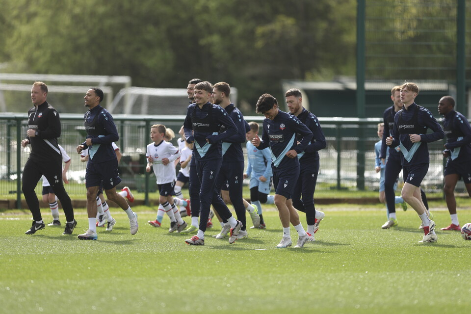 Under 8s warming up with players