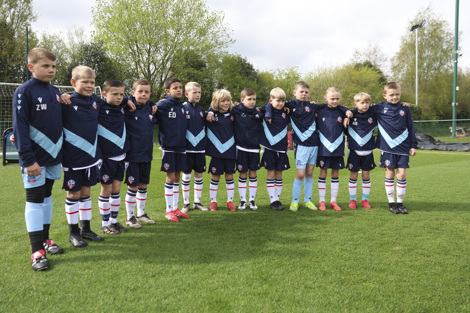 Under 8s lined up in training gear