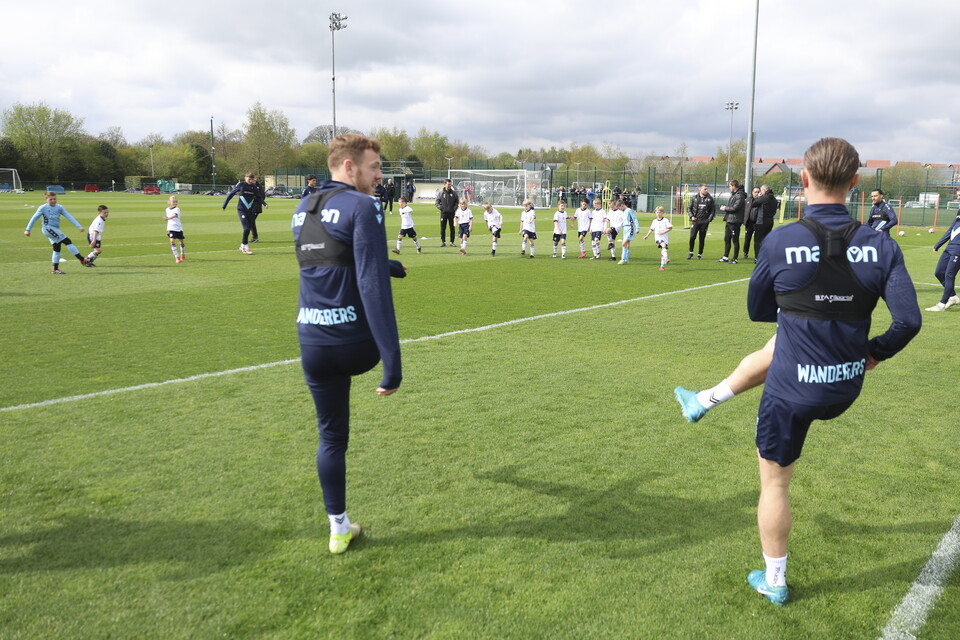 Under 8s warming up with several players