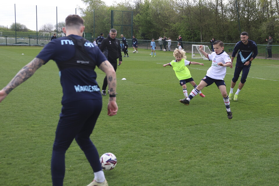 Steven Schumacher, Aaron Collins & Gethin Jones with two U8s at the Training Session