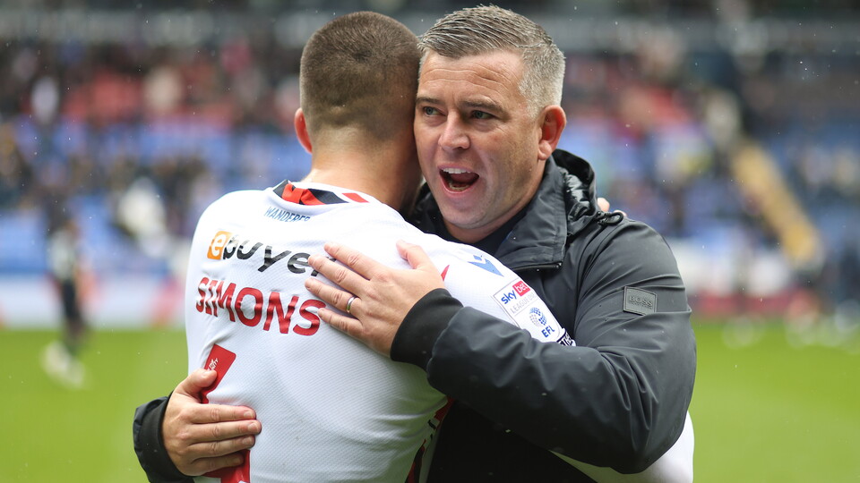 Schumacher Simons hug Wigan